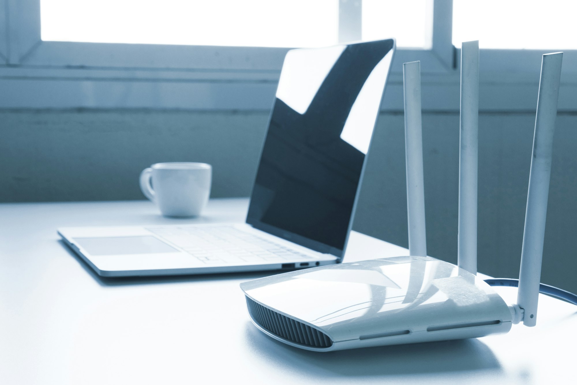 Laptop computer and router device on the table